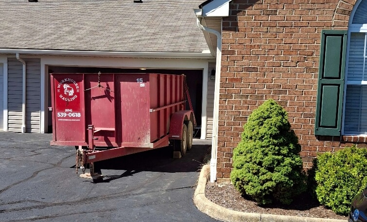 Workhorse Hauling | Trailer-Style Dumpster | Red Dumpster Placed in front of home