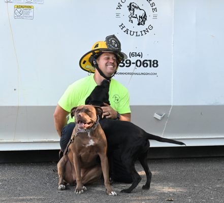 Workhorse Hauling OH | Owner of the company in front of roll-off dumpsters