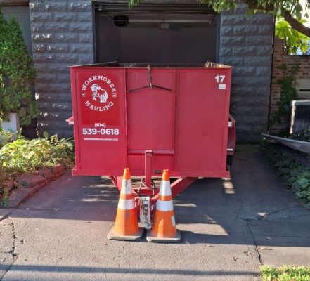 Workhorse Hauling | Trailer-Style Dumpster | Red Dumpster Placed in front of home