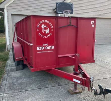 Workhorse Hauling | Trailer-Style Dumpster | Red Dumpster Placed in front of home